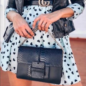 CAMELIA ROMA crossbody bag.